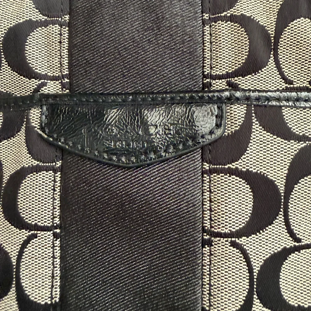 Coach Signature Stripe File Bag features a black and gray monogram canvas